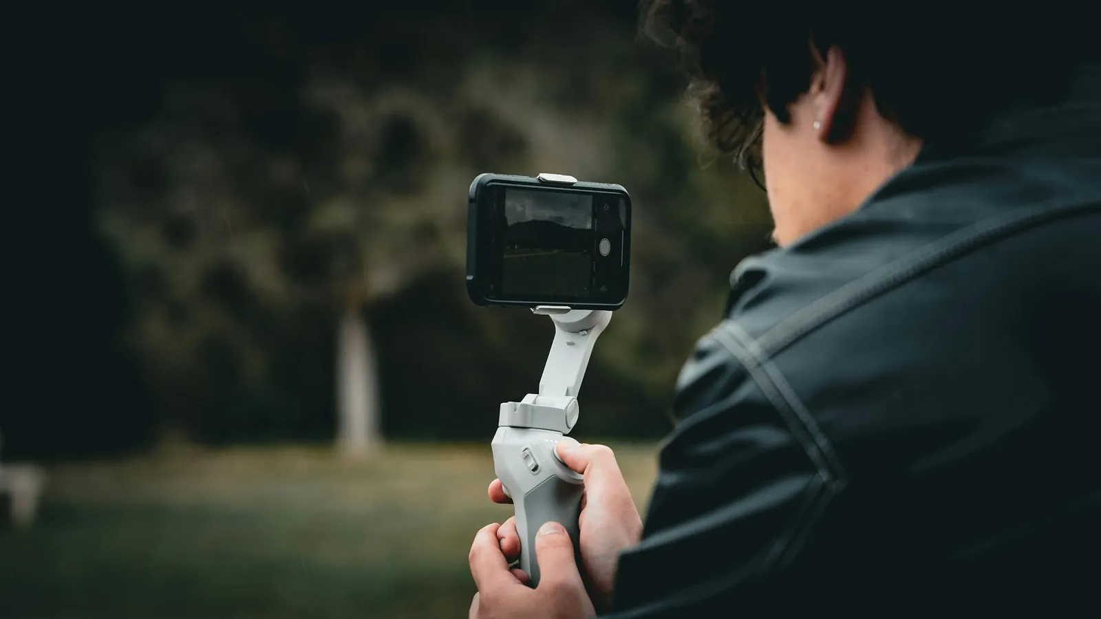 Person recording a TikTok video in-app on a smartphone using the vertical camera format